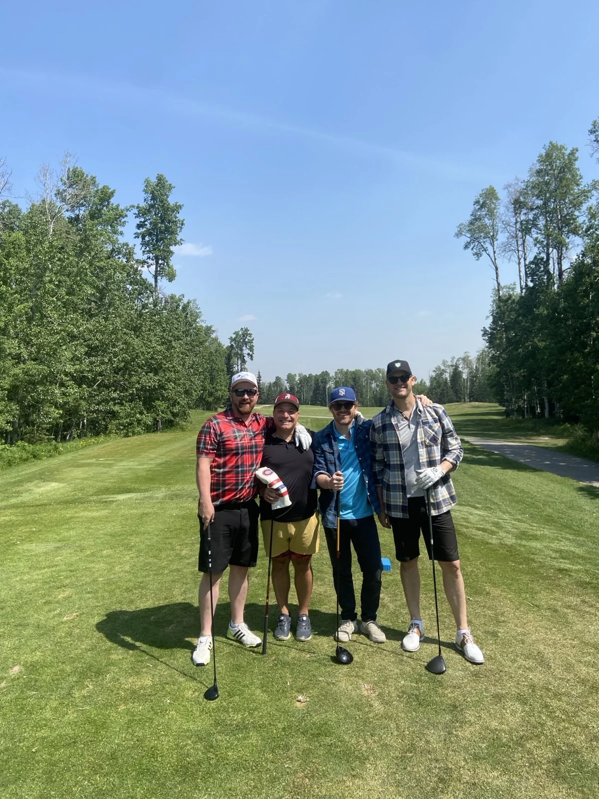 Plaid Jacket golfers together on the fairway